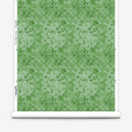 Green floral patterned paper with a white border