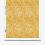 Wallpaper roll with yellow watercolor floral pattern on a white background.