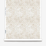 Wallpaper roll with beige watercolor floral pattern on a white background.
