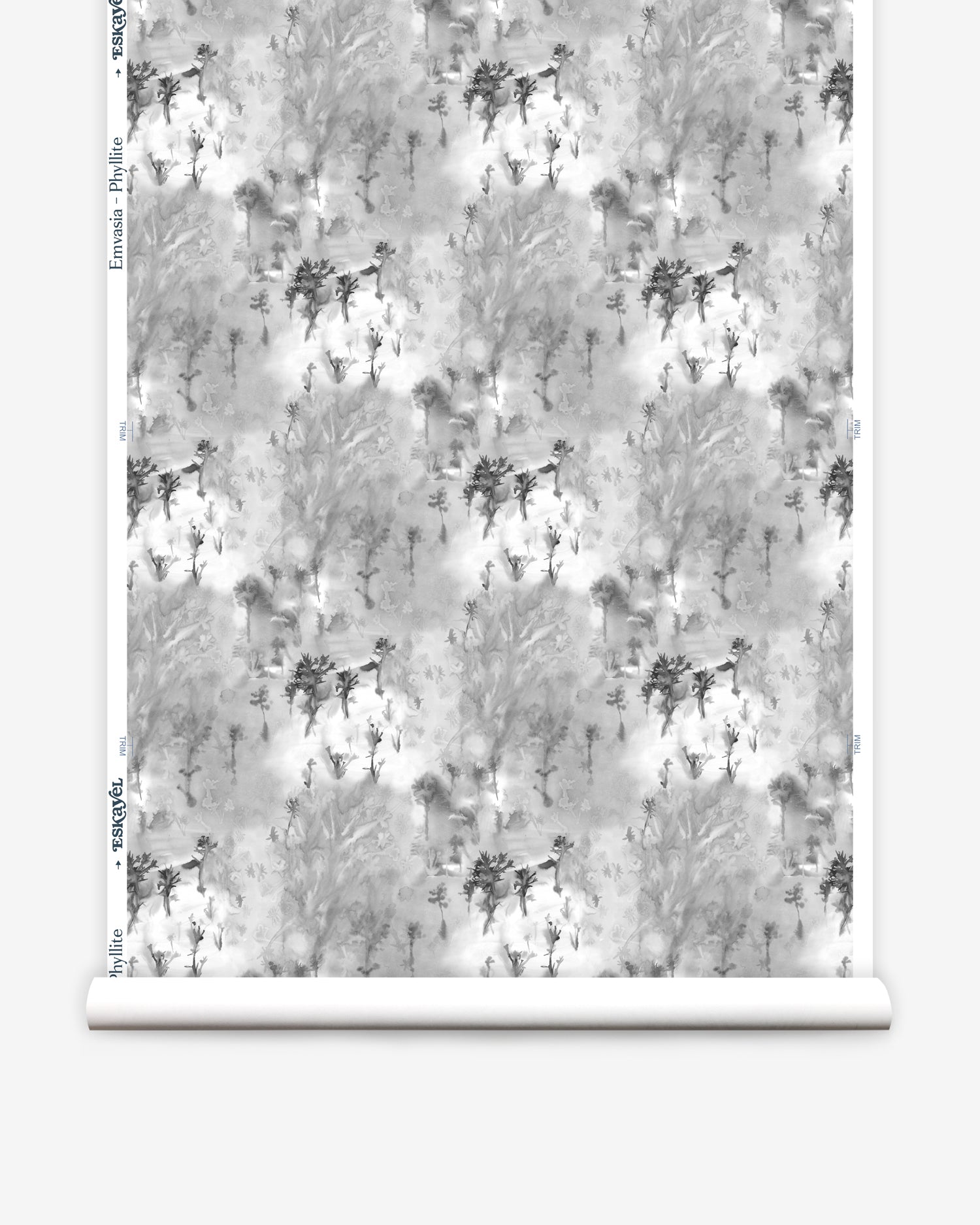 Wallpaper roll in a painterly tree print in gray and charcoal on a white field.