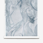 Wallpaper roll in abstract floral bushstroke design in soft slate blue. 