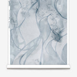 Wallpaper roll in abstract floral bushstroke design in soft slate blue. 