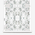 Wallpaper roll in a watercolor paint blotch print in gray and turquoise on a white field.