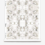 Wallpaper roll in a watercolor paint blotch print in purple and gray on a white field.