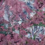 Detail of wallpaper in a painterly tree print in purple, green and brown.