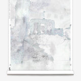 Wallpaper roll mural in a minimal splatter print in shades of gray on a cream field.