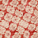 Pattern of white lace flowers on a red background