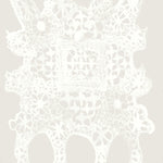 White lace doily pattern on a light gray background