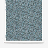 Wallpaper roll in an undulating abstract watercolor motif in shades of steel blue and charcoal. 