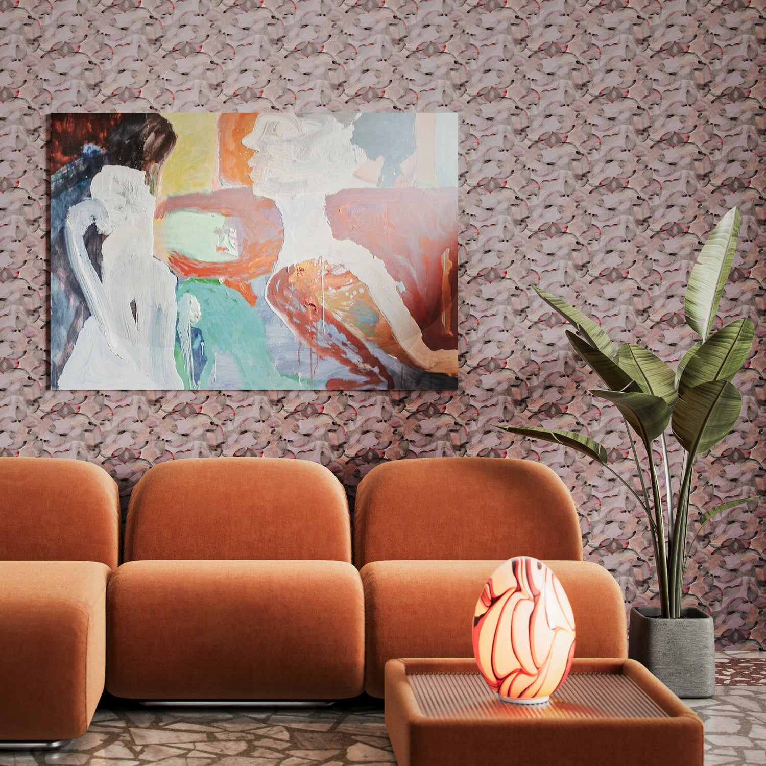 Living room scene with orange retro furniture, potted plant and abstract painting against wallpaper in an undulating abstract watercolor motif in light purple, blush, rust and charcoal.
