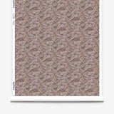 Wallpaper roll in an undulating abstract watercolor motif in light purple, blush, rust and charcoal.