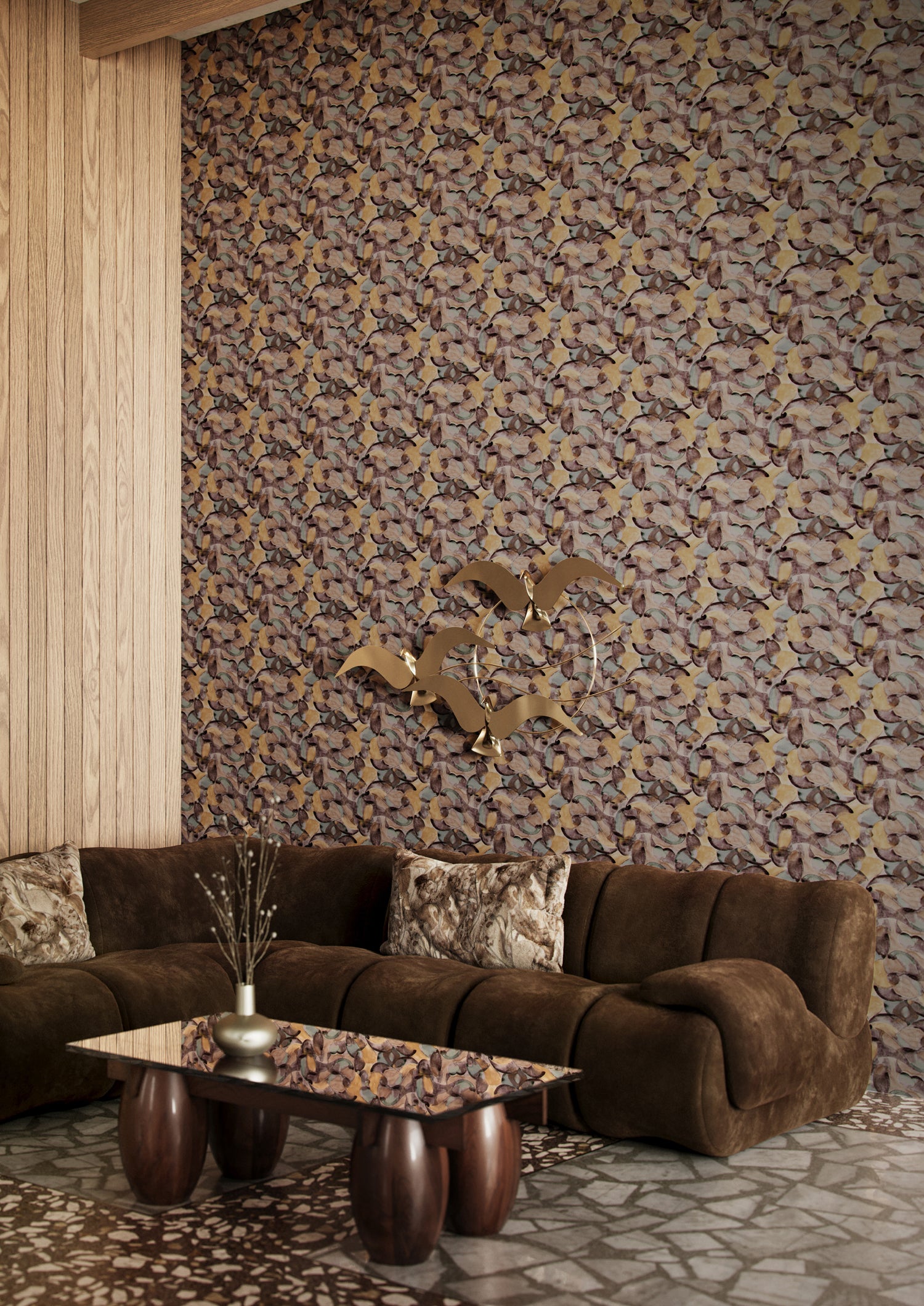 Retro living room scene with wallpaper in an undulating abstract watercolor motif in purple, tan, blue and charcoal. 