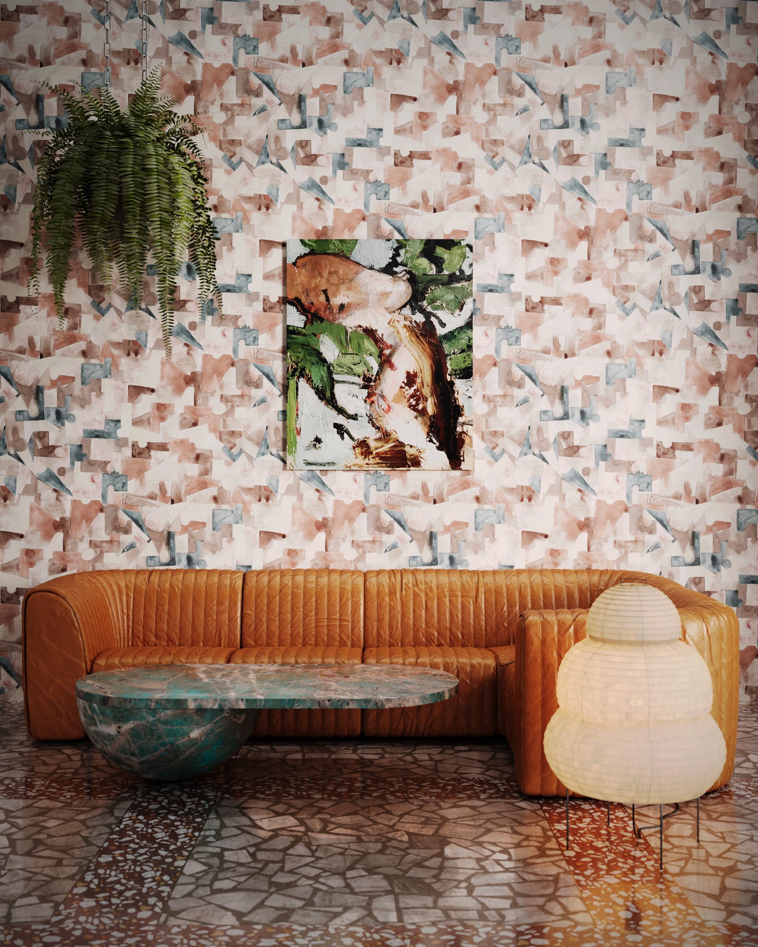 Brown fluted leather couch and vintage coffee table and paper lattern lamp against a geometric puzzle wallpaper in blush, grey and teal. 