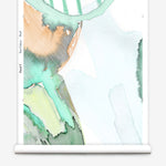 Wallpaper roll in awatercolor watercolor print in shades of purple, orange and green on a white field.