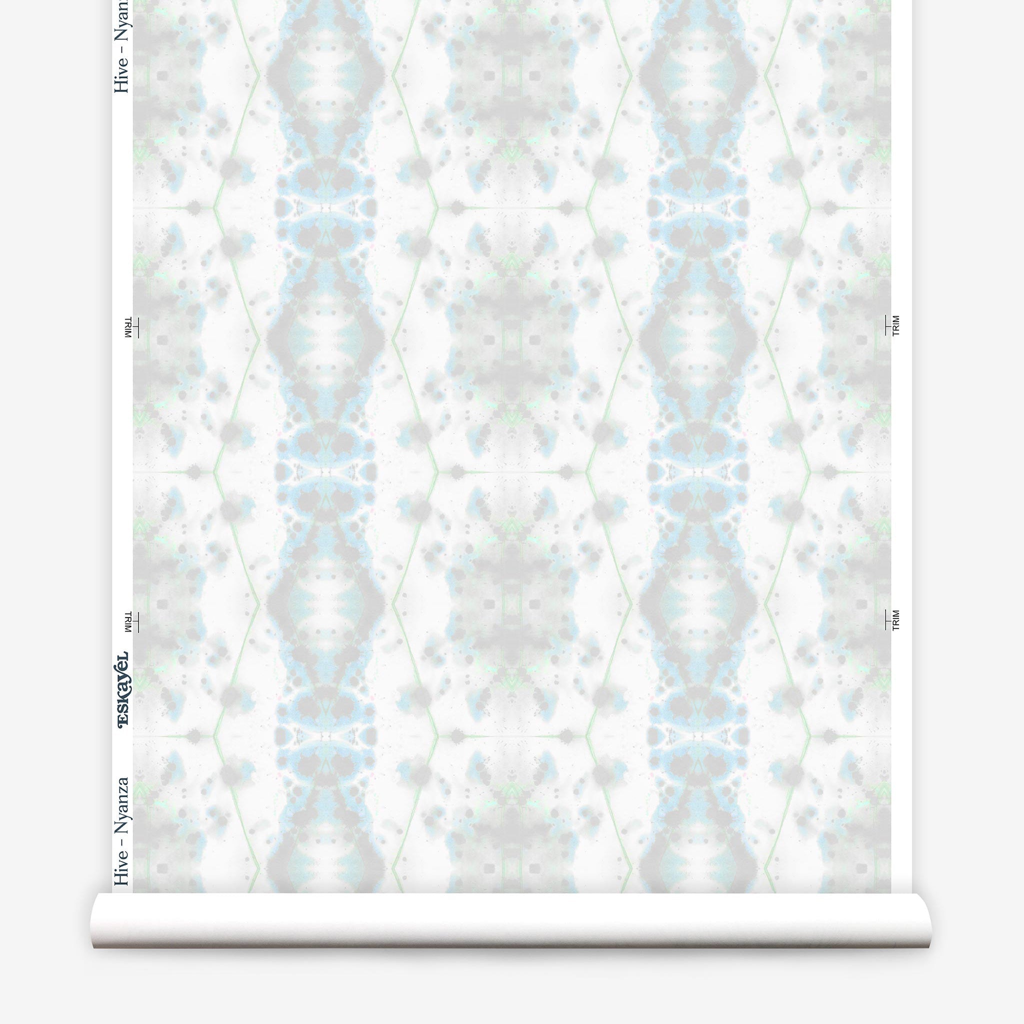 Partially unrolled wallpaper yardage in a painterly gometric stripe in gray, blue and green on a white field.