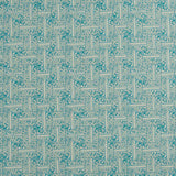 Detail of fabric in a geometric grid pattern in turquoise on a cream field.