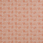 Detail of fabric in a geometric grid pattern in coral on a cream field.