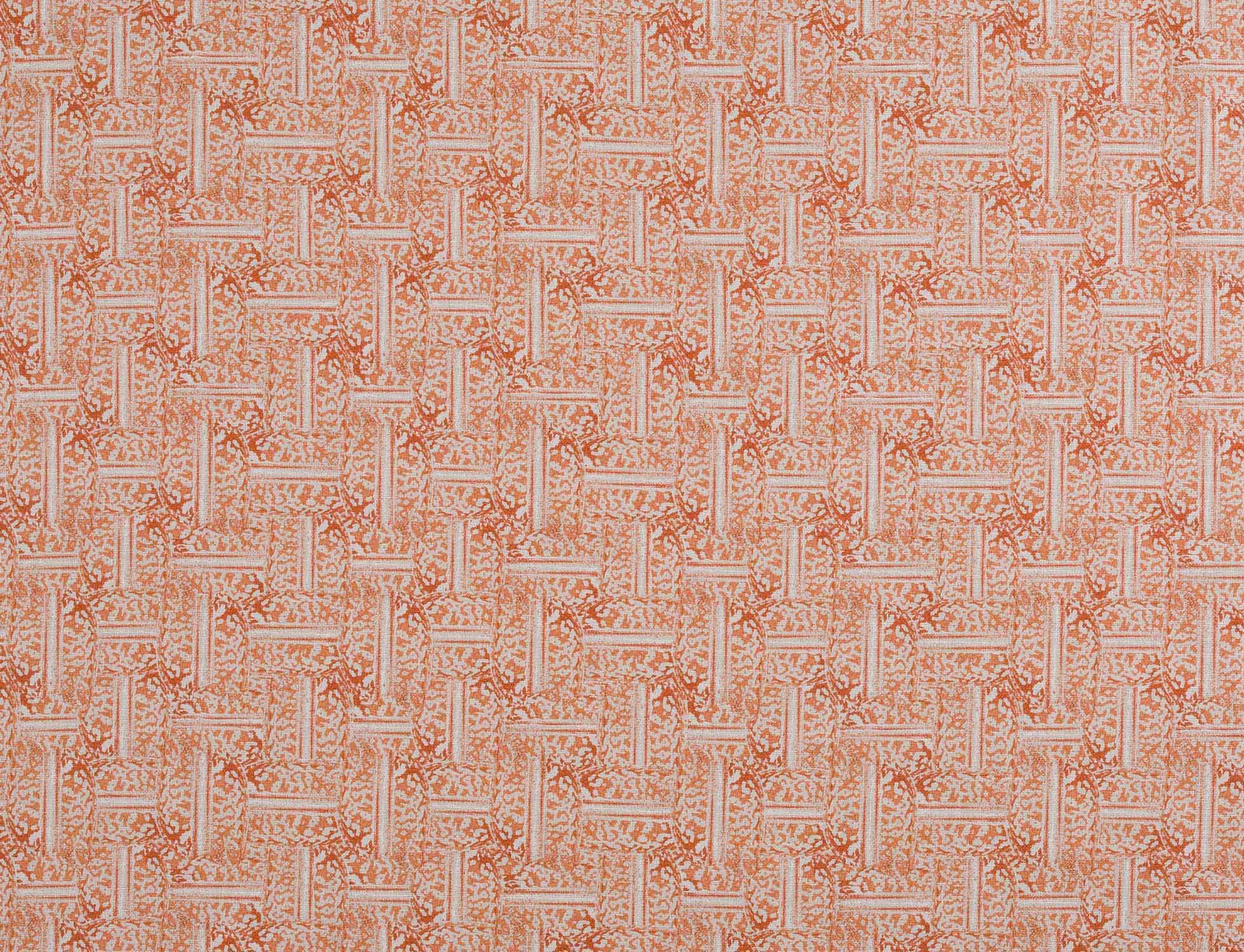 Detail of fabric in a geometric grid pattern in coral on a cream field.
