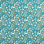 Detail of fabric in an abstract botanical print in blue, turquoise and gold on a white field.