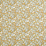 Detail of fabric in an abstract botanical print in gold and gray on a white field.
