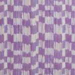 Detail of fabric in an abstract check print in shades of purple and cream.