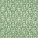Detail of fabric in a playful curvy grid print in green on a white field.
