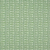 Detail of fabric in a playful curvy grid print in green on a white field.