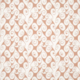 Detail of fabric in a playful abstract shape print in white on a peach field.