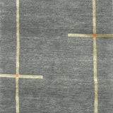 Handknotted carpet in a contempoary linear design in taupe with orange accents on a grey field. 