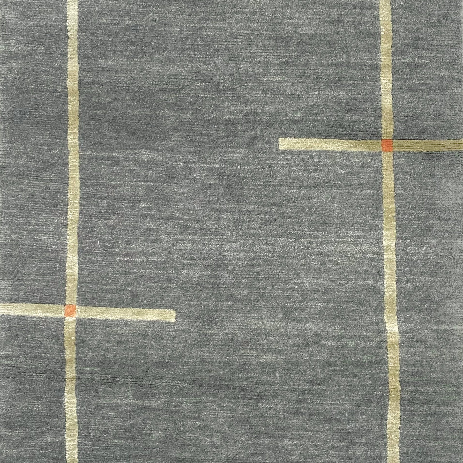 Handknotted carpet in a contempoary linear design in taupe with orange accents on a grey field. 