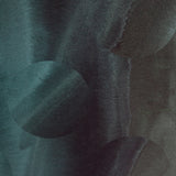Detail of wallpaper in an abstract curvilinear pattern in mottled turquoise and black.