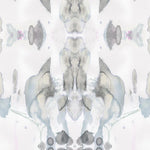 Detail of wallpaper in a watercolor paint blotch print in shades of gray and blue on a white field.
