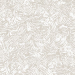 Detail of wallpaper in a painterly wave print in white on a cream field.