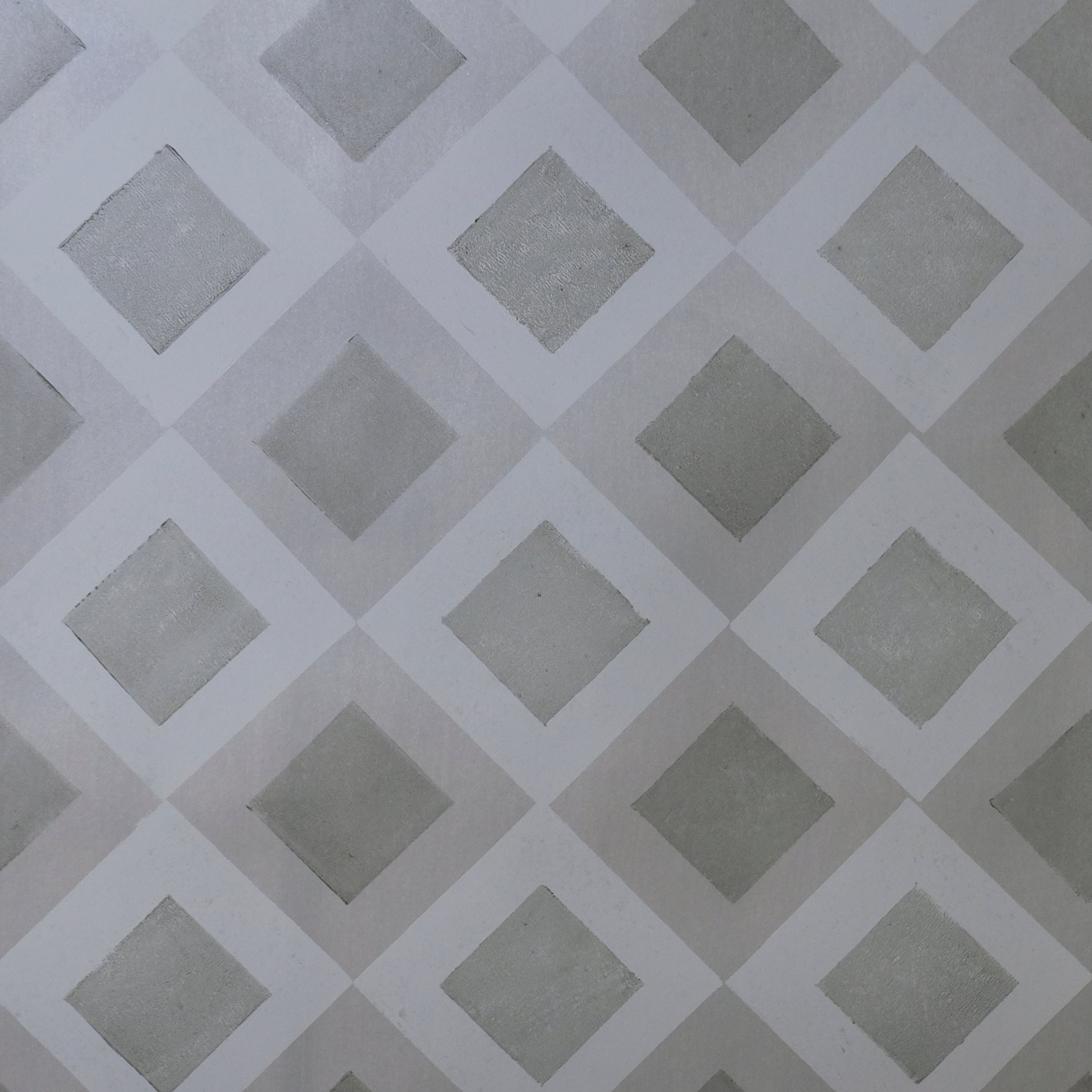Detail of wallpaper in a diamond lattice print in shades of gray.
