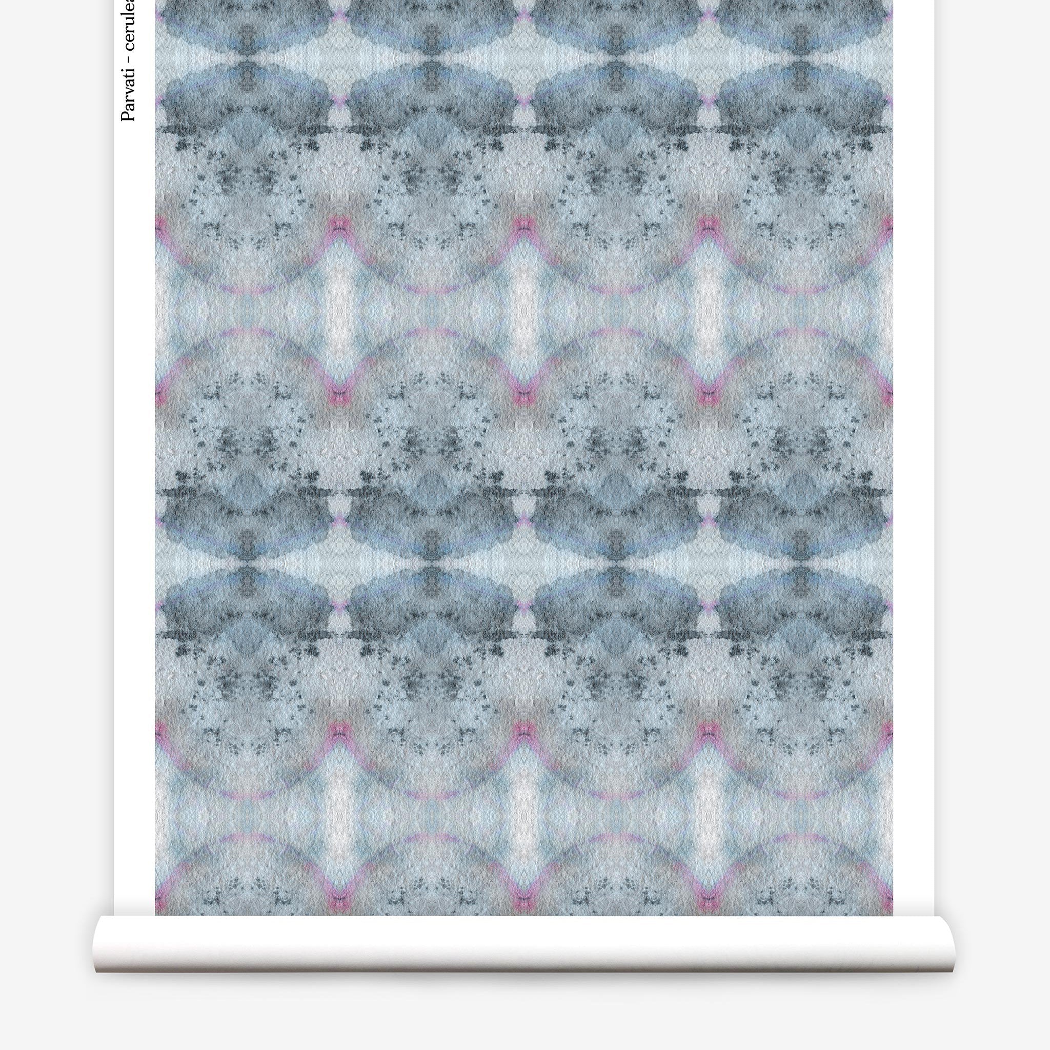 Partially unrolled wallpaper yardage in a watercolor ink blot pattern in shades of gray, blue and pink.