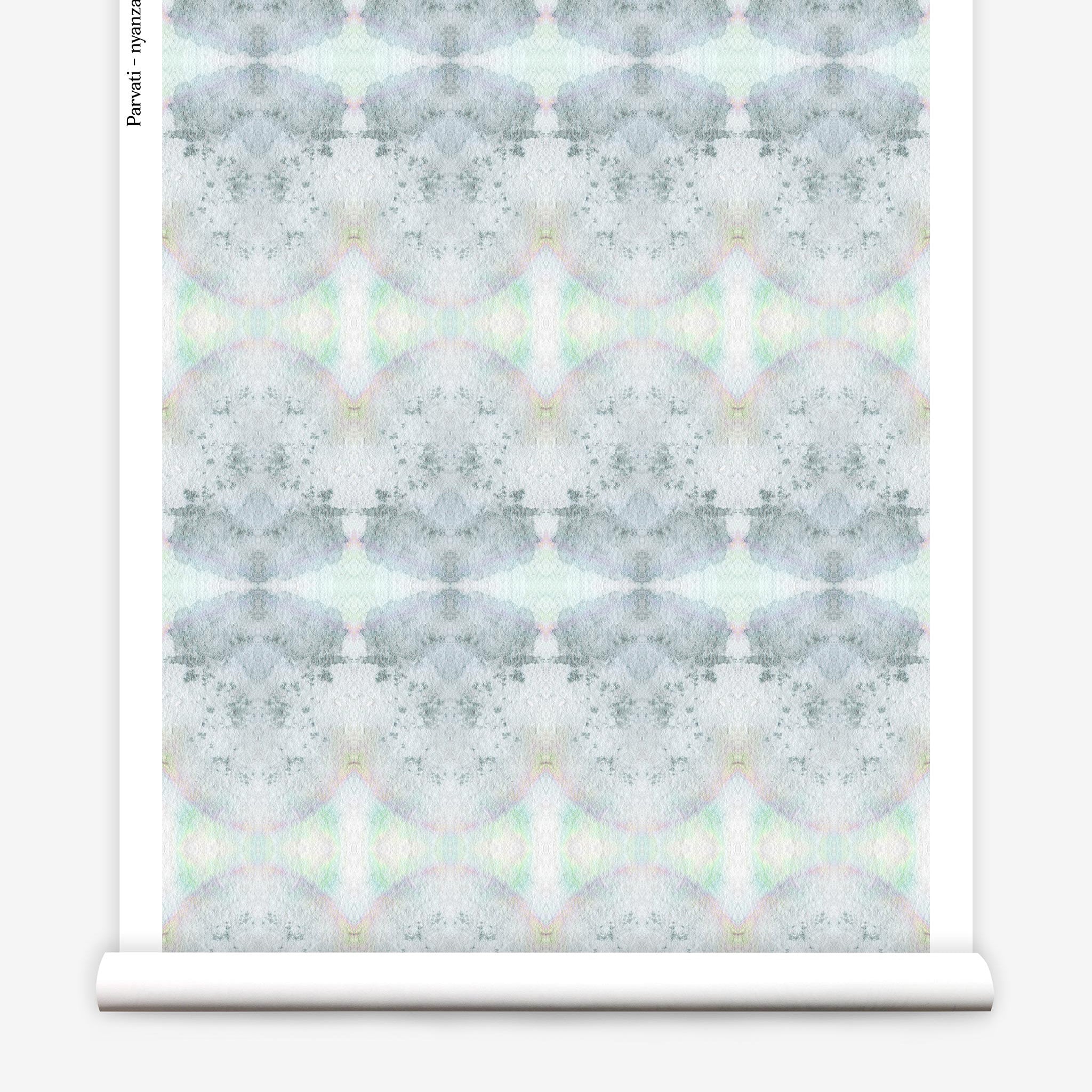 Partially unrolled wallpaper yardage in a watercolor ink blot pattern in shades of gray, green and pink.