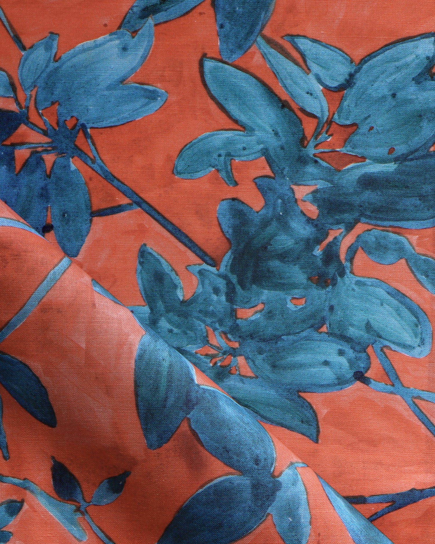 Blue floral pattern on a red background