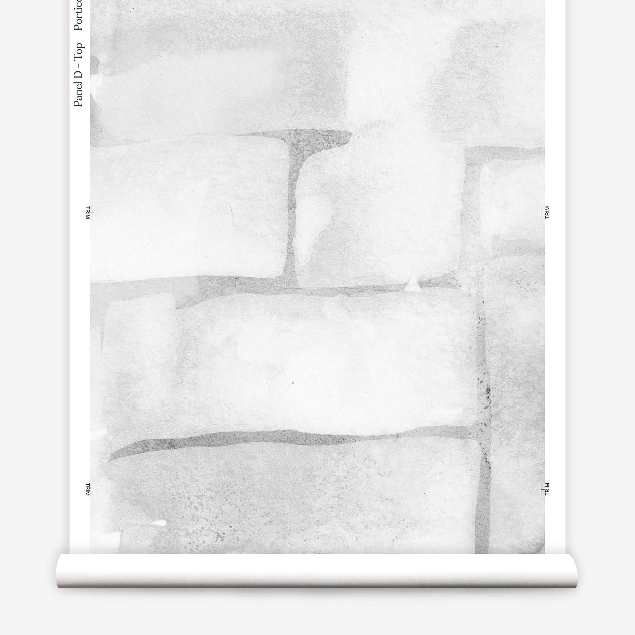 Partially unrolled wallpaper yardage in a watercolor grid print in shades of gray and white.