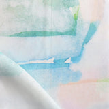 Draped fabric yardage in a watercolor watercolor print in shades of pastel and turquoise on a white field.