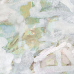 Close-up of a textured surface with a pattern in green and white.