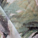 Abstract art with a mix of green, black, and white colors.