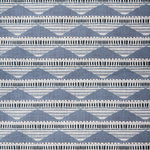 Swatch of linen fabric in a linear pattern with a sand dune-shaped triangle stripe motif in shades of navy, light blue and gray.