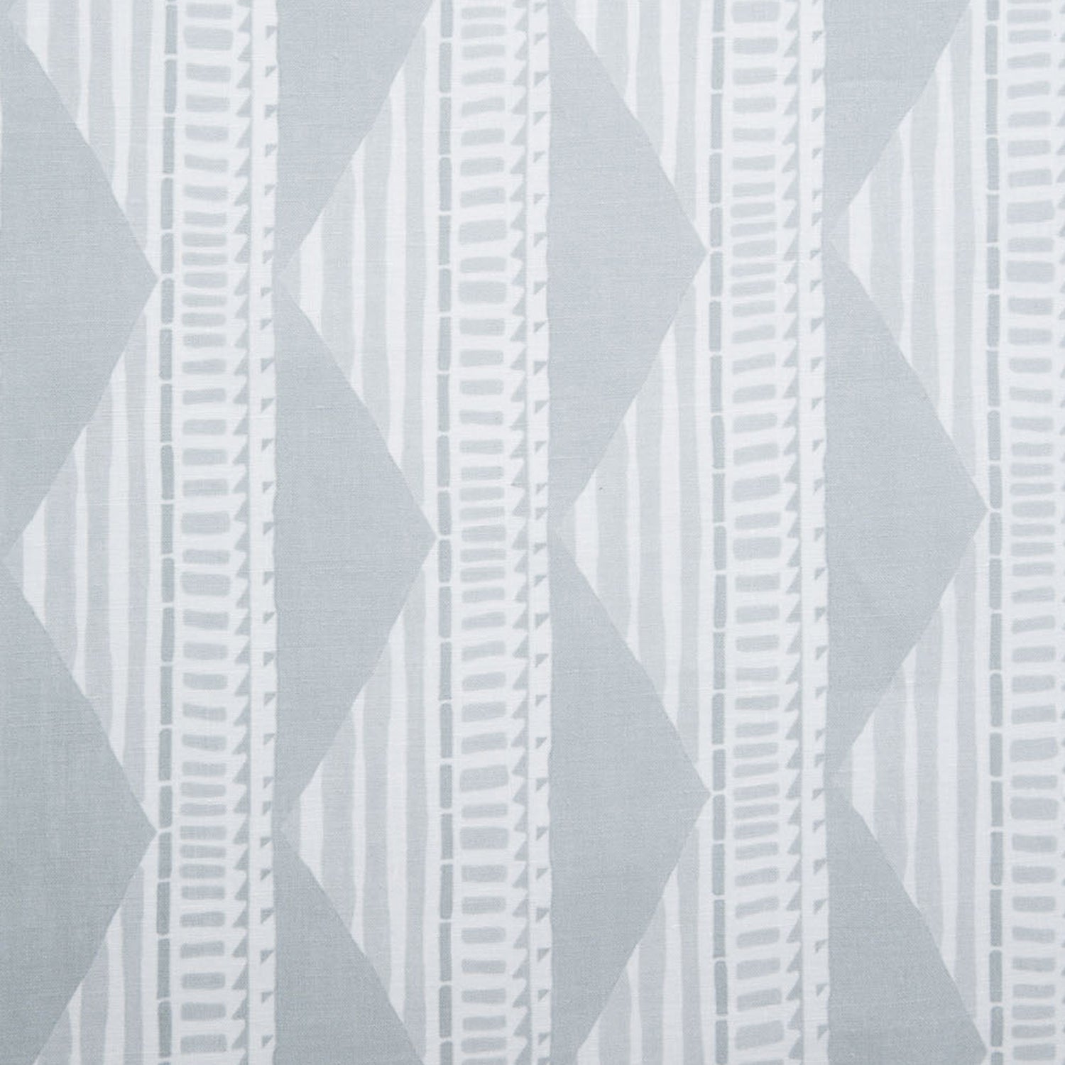 Sheer linen fabric swatch in a horizontal stripe pattern broken with triangluar shapes, in shades of gray.