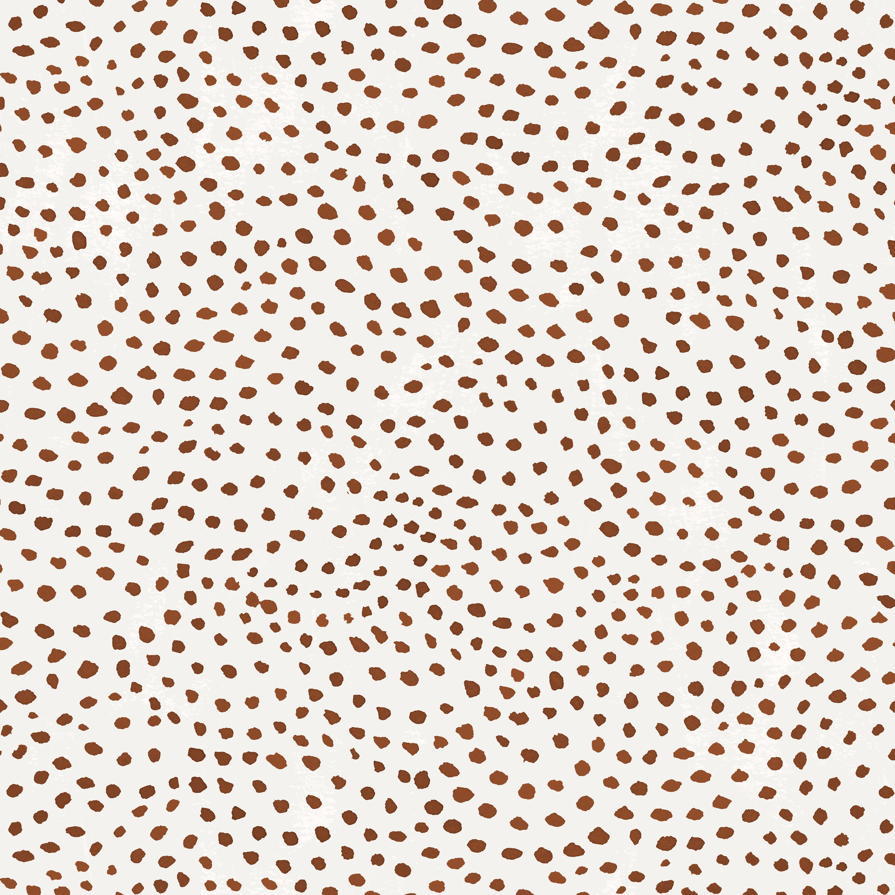 Detail of wallpaper in a scalloped dot print in rust on a cream field.