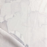 Draped fabric yardage in a watercolor watercolor print in shades of gray and purple on a white field.