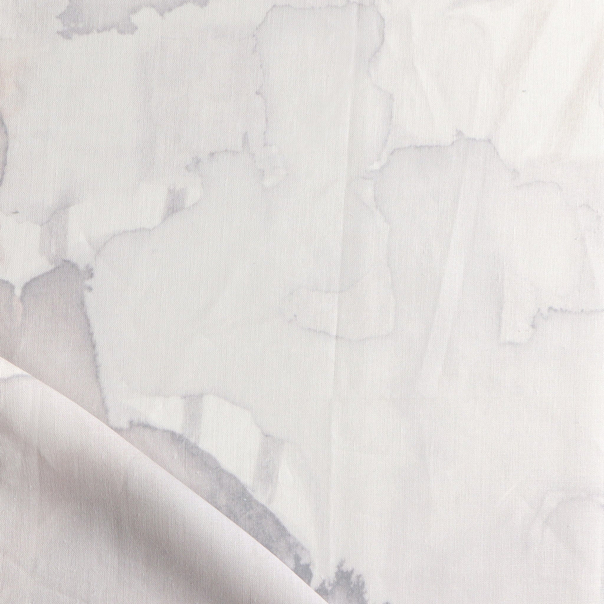 Draped fabric yardage in a watercolor watercolor print in shades of gray and purple on a white field.