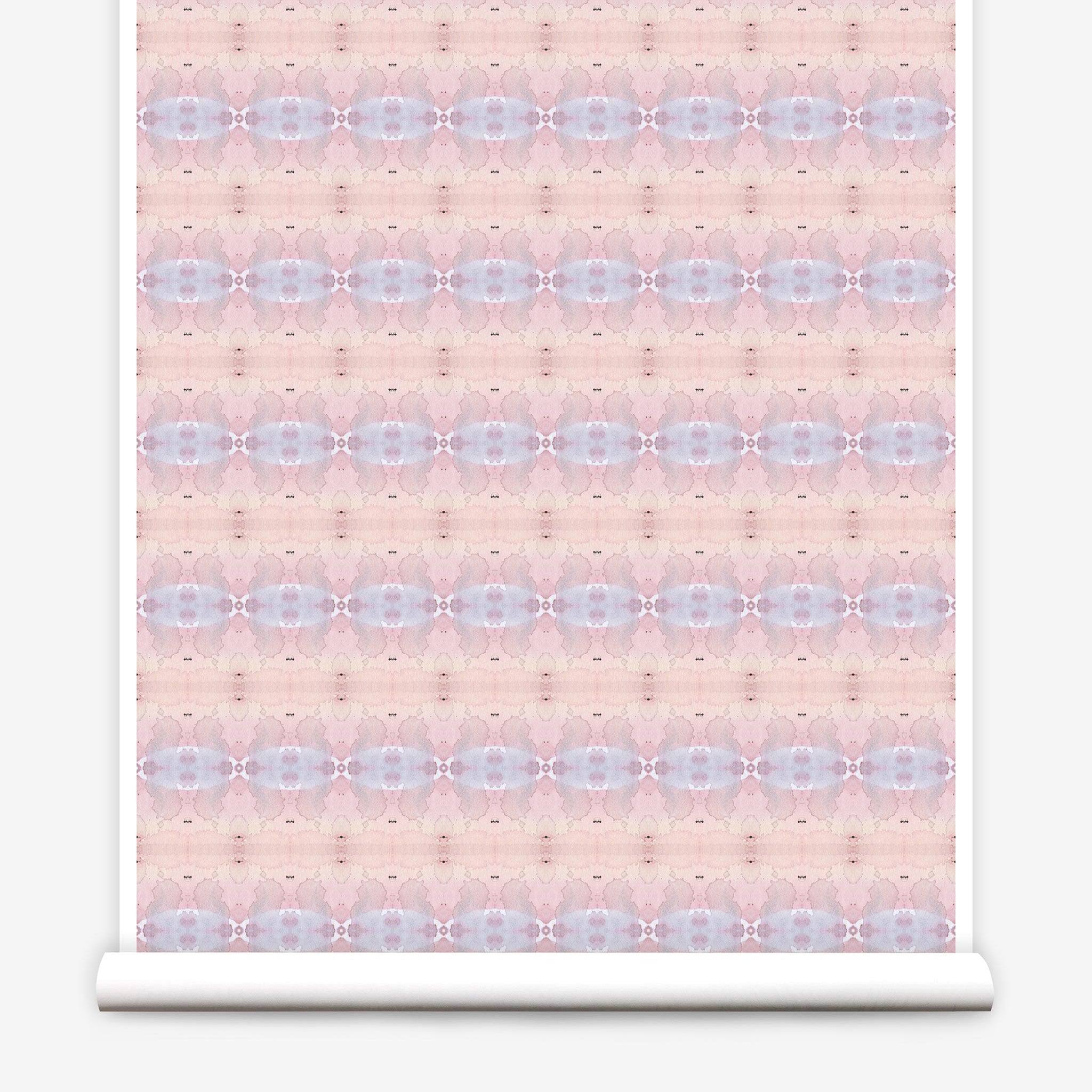 Partially unrolled wallpaper yardage in a gridded paint splatter print in shades of pink, blue, tan and white.