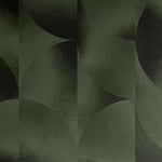 Detail of wallpaper in an abstract curvilinear print in mottled green and black.