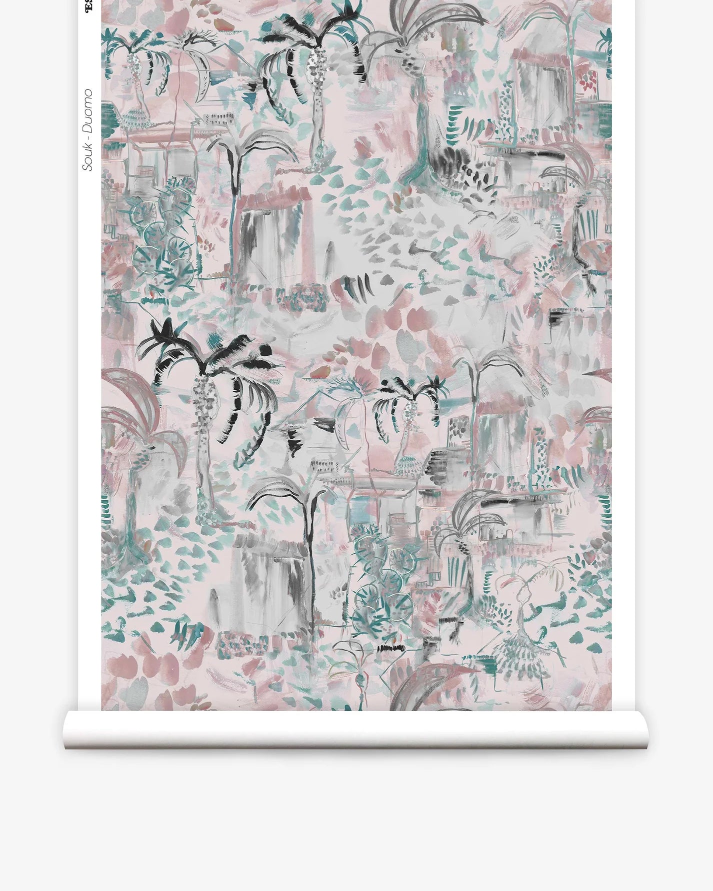 Partially unrolled wallpaper yardage in a painterly tree print in shades of gray, pink and turquoise.