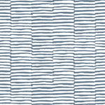 Detail of wallpaper in a broken stripe print in navy on a white field.
